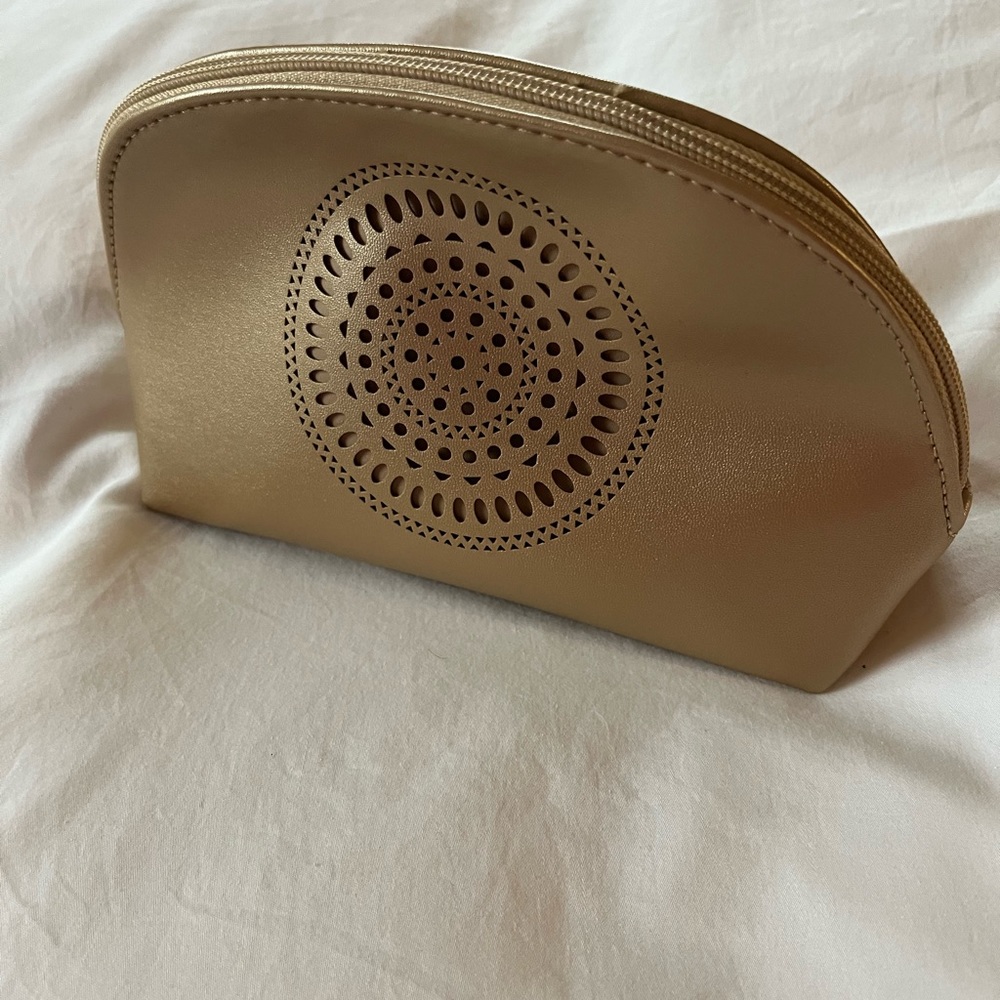 Zipped Makeup bag from Neiman Marcus.  Gold colored exterior & interior.
